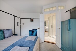 Bedroom Retreat: Stylishly adorned space with vibrant accents and an ensuite shower for true relaxation!