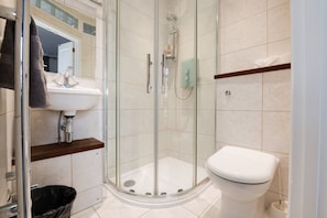 Spacious bathroom with nice shower will help you relax after a nice night out on the town.