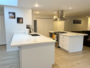 Kitchen and kitchen island with a gas stove