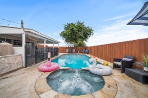 Hot tub offers warm, bubbling water, perfect for relaxing with loved ones.