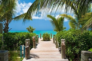 Take a stroll down our boardwalk to award winning Grace Bay beach