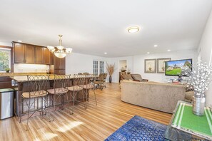 Overview of kitchen/family room. French doors leads to the sun room.