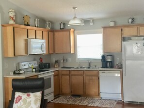 Full kitchen stocked with everything you need to cook.