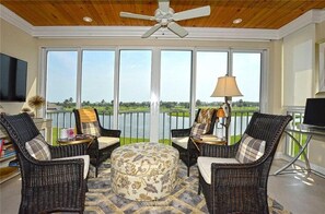 Sitting area overlooking the golf course and lake.