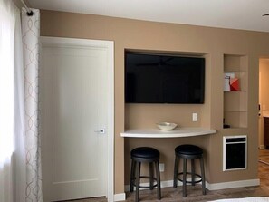 Flat screen TV and eating area