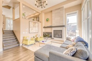 Mountain view main living room that is connected to the large back balcony