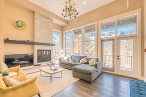 Mountain view main living room that is connected to the large back balcony