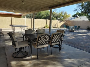 Seating for 6 under a large covered patio