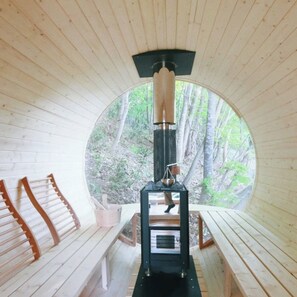 The bright interior of the barrel sauna at Sapporo Glamping Villa Carta