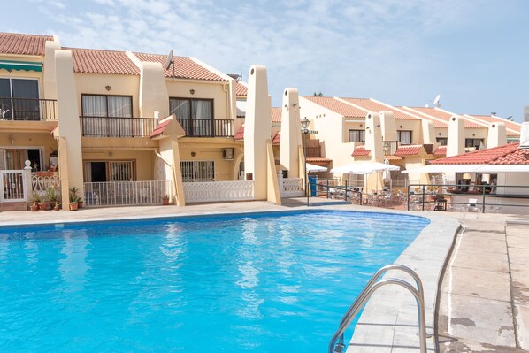 View of communal heated pool and bar / restaurant