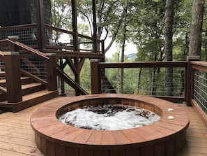 Cedar hot tub, in the woods,  with views of mountains.