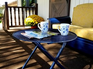 Cozy front porch, perfect for enjoying morning coffee. 