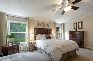 Large Master Bedroom with a comfy Queen bed, cotton sheets & usb lamps.