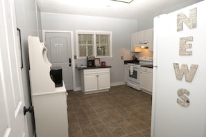 Kitchen with door to laundry.