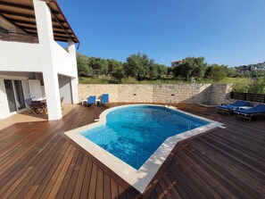 Pool, sun-beds and outside seating area
