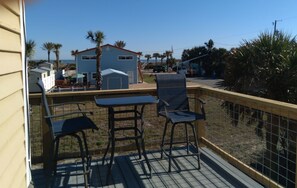 Deck off of Kitchen and view of the Ocean.