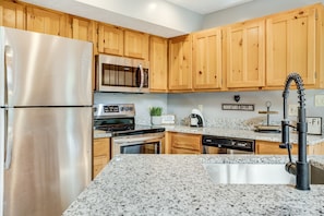 This kitchen has all you need including a crock-pot, blender, and Keurig. 