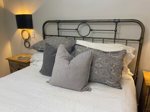 Primary bedroom with all the pillows