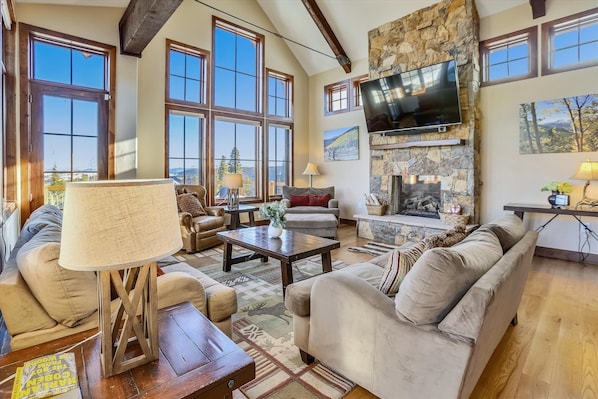 Living Area - Your group can take in the mountain views or a show in this cozy living room - Baldy Mountain Overlook Breckenridge Vacation Rental