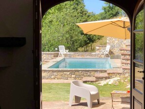 View of the pool from the kitchen/ dining room