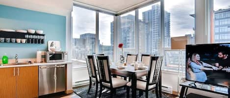 Walk in and impress friends and family with floor to ceiling views of Seattle, a separate dining area, beautiful decor, an open living space, and much more.