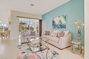 The elegant sitting room in the front of the home is the perfect spot for friendly conversation.