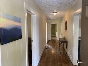 Main Hallway to All Three Rooms and Bathroom at End of Hallway