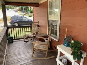 Rocking Chairs on One Side of Porch and Glider Couch on the Other