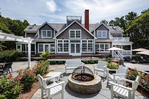 Fire Pit Seating Between Pool And Dining Area