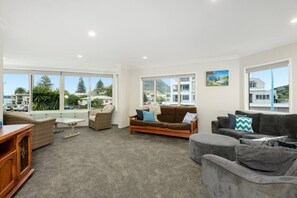 spacious living area with sunny viewing nook