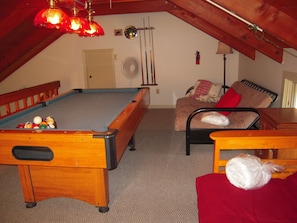 Loft with pool table and 2 futons