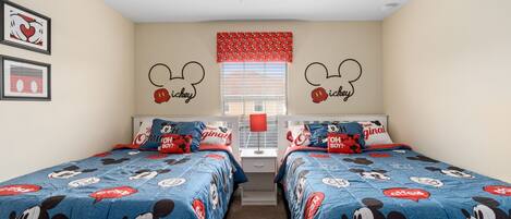 Double beds decorated in Mickey Mouse