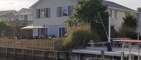 Fenced in gated back deck on canal and upper level deck