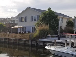 Fenced in gated back deck on canal and upper level deck