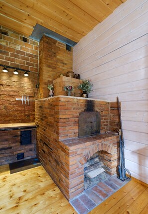 Well-lit walnut surface provides plenty of space for food preparation.