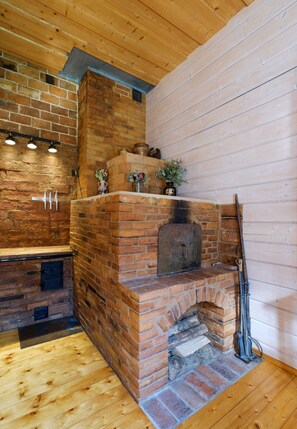 Well-lit walnut surface provides plenty of space for food preparation.