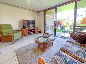 Open bright living room with tropical feel