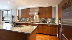 Kitchen with high end appliances and coffee station nook