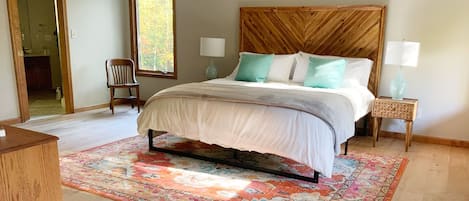 Master bedroom with separate sitting area / recliner, view of waterfall