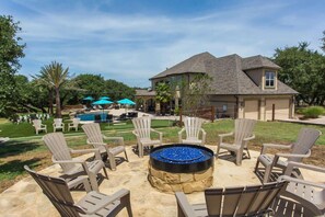 20-Foot Stone Patio with Twelve Adirondack Chairs To Enjoy the Cooler Evenings Around the Fire Pit