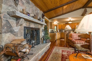 Main level family room with wood burning fireplace
