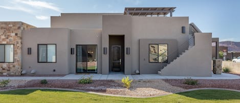 Side View of Home - VIew of entry way and stairs leading to private rooftop patio.