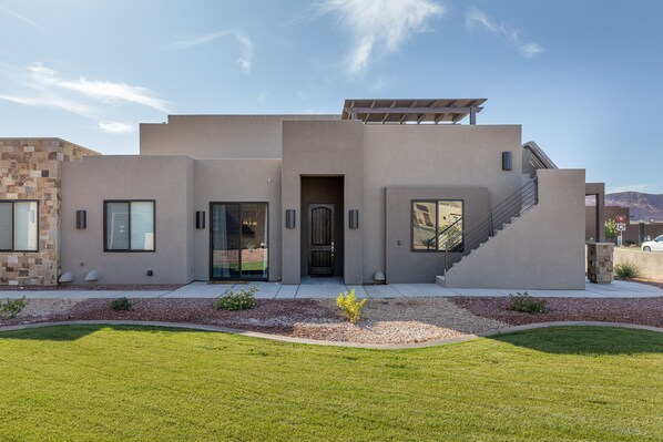 Side View of Home - VIew of entry way and stairs leading to private rooftop patio.