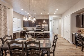 Dining Table - With an open and spacious floor plan, the Dining Room and Kitchen can accommodate meal preparations for groups large or small.