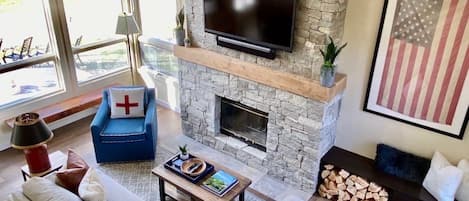 Spacious living room with cathedral ceilings and lots of natural light