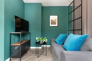 Living room with sofa, coffee table and tv