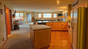 Open concept kitchen beautiful quartz countertops, on the island and peninsula 