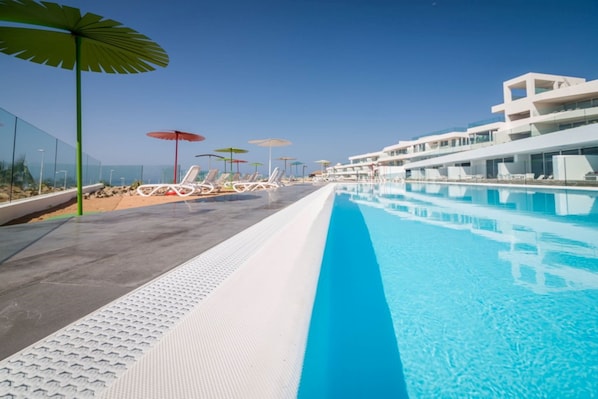 Get some sun in the shared outdoor pool.