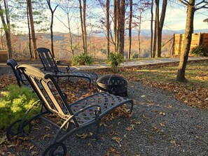 Relax by a fire while enjoying the magnificent view of the mountains 