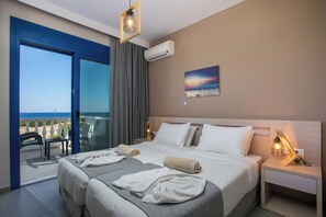 Bedroom on the upper level with view towards the sea